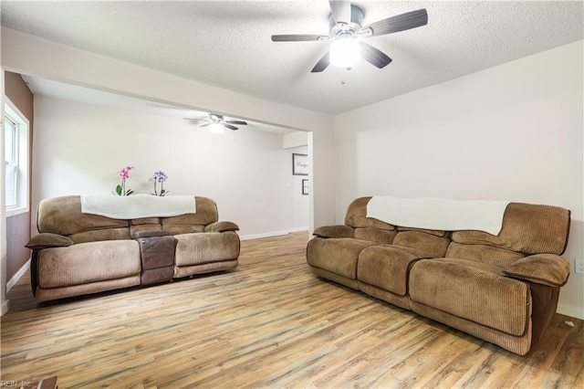 891 Bells Mill Rd, Chesapeake, VA 23322 - living area with wood finished floors, baseboards, a ceiling fan, and a textured ceiling