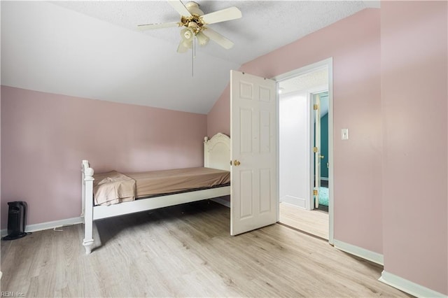 891 Bells Mill Rd, Chesapeake, VA 23322 - unfurnished bedroom with wood finished floors, baseboards, a ceiling fan, lofted ceiling, and a textured ceiling
