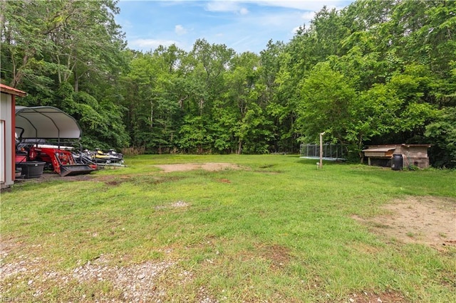 891 Bells Mill Rd, Chesapeake, VA 23322 - view of grassy yard with a carport and a view of trees