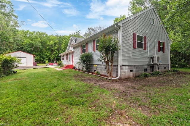 891 Bells Mill Rd, Chesapeake, VA 23322 - view of home's exterior with an outdoor structure, ac unit, a detached garage, and a yard