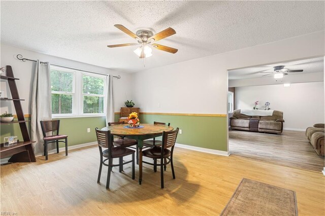 891 Bells Mill Rd, Chesapeake, VA 23322 - dining area with ceiling fan, light wood finished floors, a textured ceiling, and baseboards