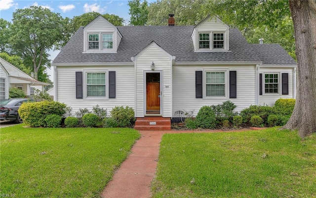 746 Burksdale Rd, Norfolk, VA 23518 - cape cod house with a front lawn, a shingled roof, and a chimney