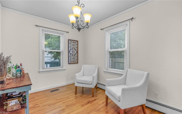 746 Burksdale Rd, Norfolk, VA 23518 - sitting room with a baseboard radiator, a chandelier, light wood-type flooring, crown molding, and baseboards
