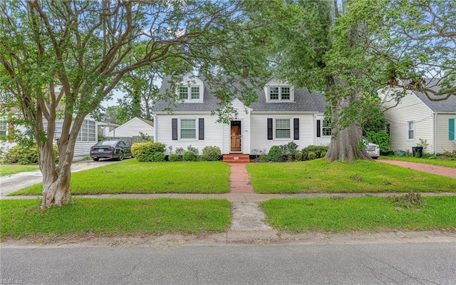 746 Burksdale Rd, Norfolk, VA 23518 - cape cod-style house with a front lawn and a shingled roof