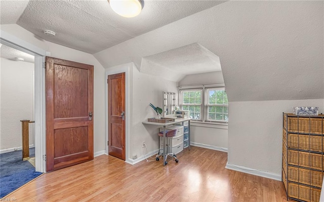 746 Burksdale Rd, Norfolk, VA 23518 - additional living space featuring a textured ceiling, lofted ceiling, wood finished floors, and baseboards