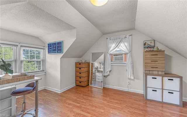 746 Burksdale Rd, Norfolk, VA 23518 - additional living space with light wood-style floors, a textured ceiling, healthy amount of natural light, vaulted ceiling, and baseboards
