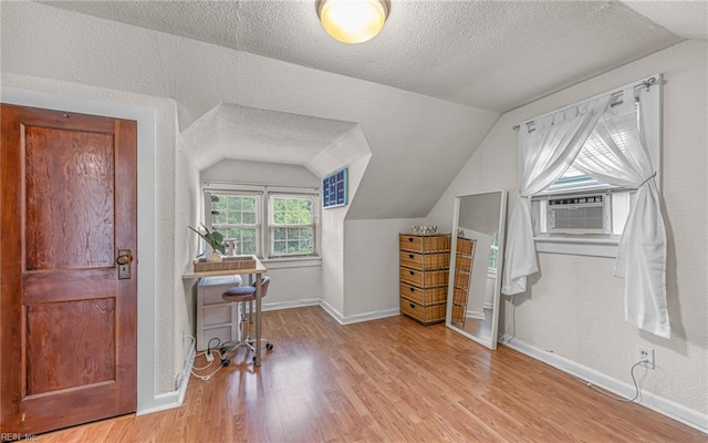 746 Burksdale Rd, Norfolk, VA 23518 - home office with vaulted ceiling, baseboards, wood finished floors, and a textured ceiling