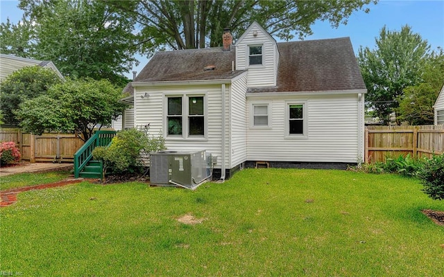 746 Burksdale Rd, Norfolk, VA 23518 - back of property with central AC, a chimney, and a shingled roof