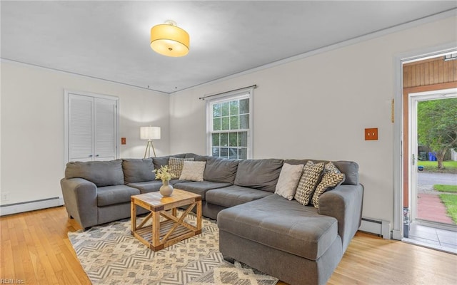 746 Burksdale Rd, Norfolk, VA 23518 - living room featuring baseboard heating, light wood finished floors, a baseboard radiator, and crown molding