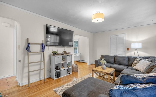 746 Burksdale Rd, Norfolk, VA 23518 - living room with arched walkways, light wood finished floors, baseboards, and crown molding