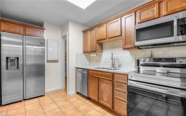 746 Burksdale Rd, Norfolk, VA 23518 - kitchen featuring stainless steel appliances, tasteful backsplash, light tile patterned flooring, and a sink