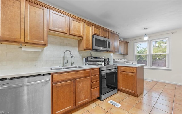 746 Burksdale Rd, Norfolk, VA 23518 - kitchen with appliances with stainless steel finishes, decorative backsplash, light tile patterned floors, and a sink
