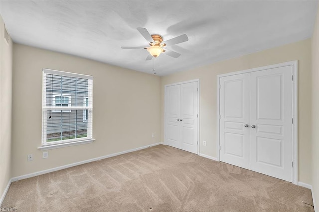 5018 Kings Grant Cir, Suffolk, VA 23434 - unfurnished bedroom featuring two closets, carpet, and baseboards