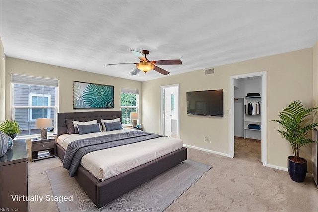 5018 Kings Grant Cir, Suffolk, VA 23434 - bedroom featuring light carpet, baseboards, a walk in closet, ceiling fan, and connected bathroom