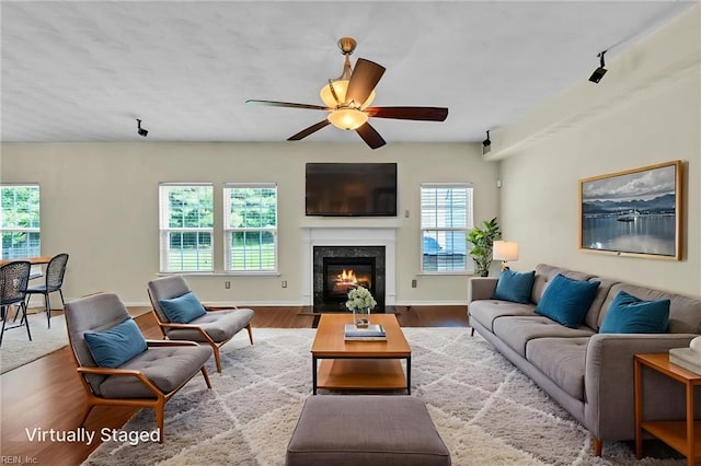 5018 Kings Grant Cir, Suffolk, VA 23434 - living area with wood finished floors, ceiling fan, a premium fireplace, and baseboards