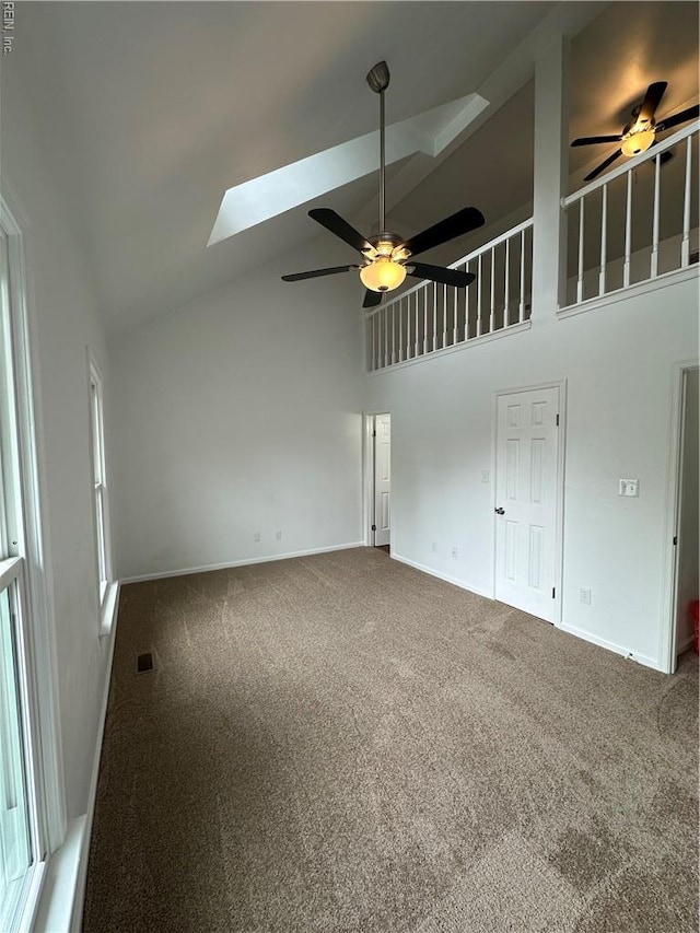1183 Killington Arch, Chesapeake, VA 23320 - spare room with a ceiling fan, high vaulted ceiling, a skylight, carpet flooring, and baseboards