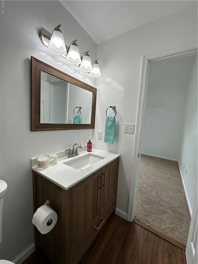 1183 Killington Arch, Chesapeake, VA 23320 - bathroom with vanity, toilet, baseboards, and wood finished floors