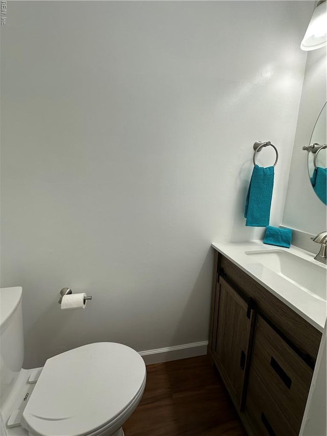 1183 Killington Arch, Chesapeake, VA 23320 - half bath with vanity, toilet, wood finished floors, and baseboards