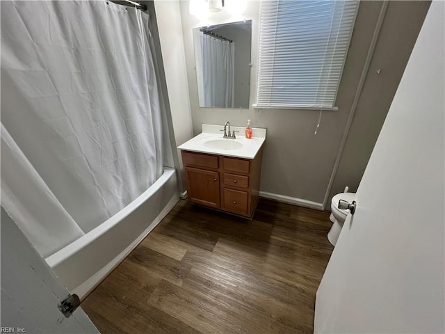 714 B St, Chesapeake, VA 23324 - full bath with wood finished floors, baseboards, vanity, and shower / bath combo with shower curtain