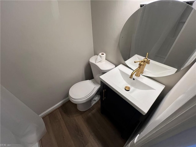 714 B St, Chesapeake, VA 23324 - bathroom featuring wood finished floors, toilet, vanity, and baseboards