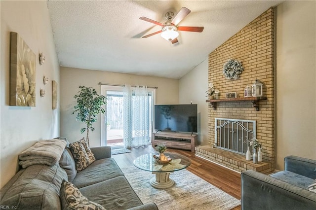1700 Dylan Dr, Virginia Beach, VA 23464 - living room featuring ceiling fan, wood finished floors, lofted ceiling, a textured ceiling, and a fireplace
