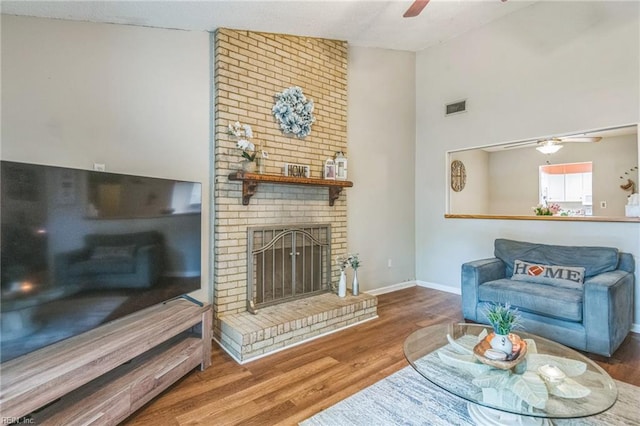 1700 Dylan Dr, Virginia Beach, VA 23464 - living area with ceiling fan, wood finished floors, a fireplace, baseboards, and high vaulted ceiling