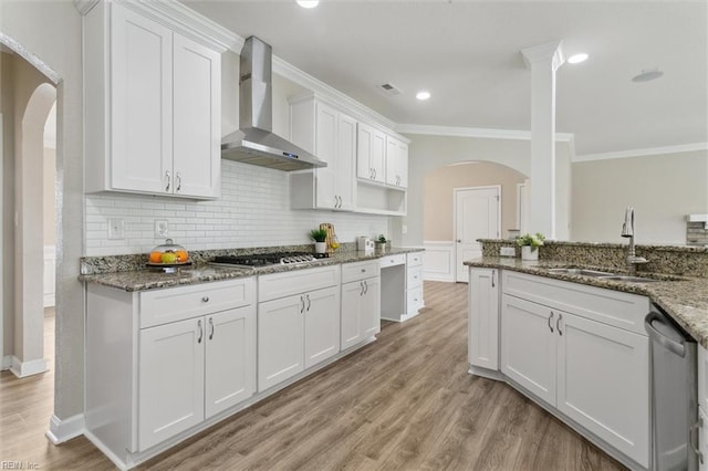 105 Brogden Ct, Hampton, VA 23666 - kitchen featuring wall chimney exhaust hood, a sink, stainless steel appliances, arched walkways, and ornamental molding