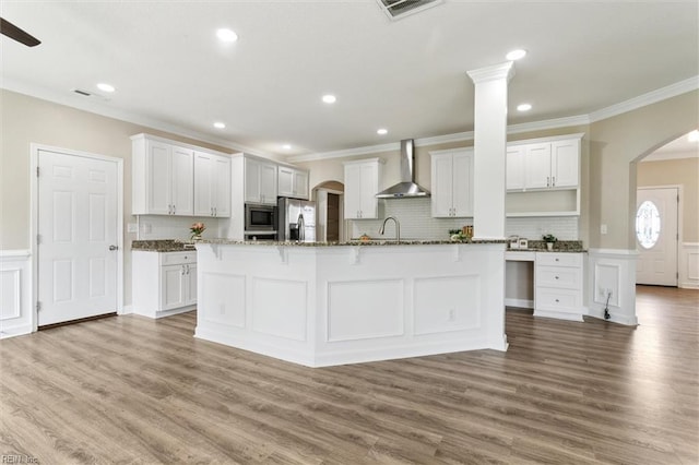 105 Brogden Ct, Hampton, VA 23666 - kitchen with wall chimney exhaust hood, stainless steel appliances, arched walkways, crown molding, and a sink