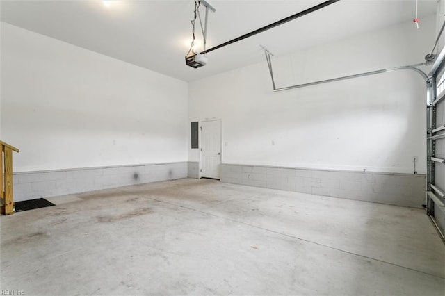 105 Brogden Ct, Hampton, VA 23666 - garage featuring a garage door opener, electric panel, and concrete block wall