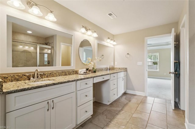 105 Brogden Ct, Hampton, VA 23666 - full bathroom featuring double vanity, a shower stall, and baseboards