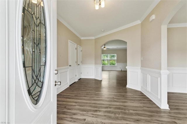 105 Brogden Ct, Hampton, VA 23666 - entrance foyer featuring arched walkways, dark wood-type flooring, crown molding, wainscoting, and a ceiling fan