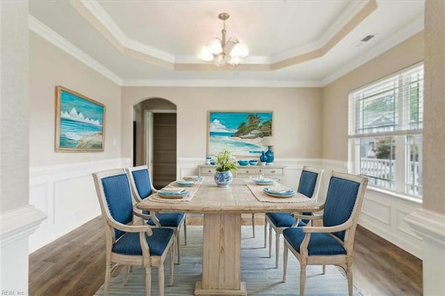 105 Brogden Ct, Hampton, VA 23666 - dining area with dark wood finished floors, a decorative wall, a raised ceiling, a chandelier, and a wainscoted wall