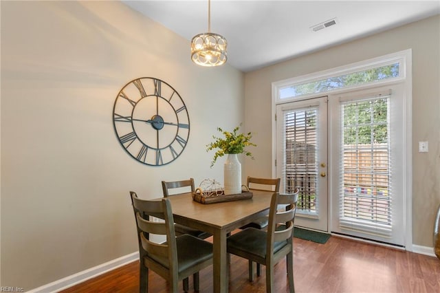 711 Windbrook Cir, Newport News, VA 23606 - dining room featuring baseboards, wood finished floors, and a chandelier