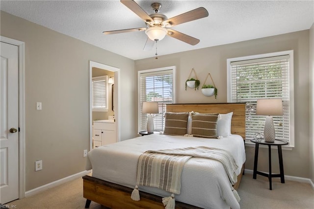 711 Windbrook Cir, Newport News, VA 23606 - bedroom featuring carpet flooring, baseboards, ensuite bathroom, a ceiling fan, and a textured ceiling