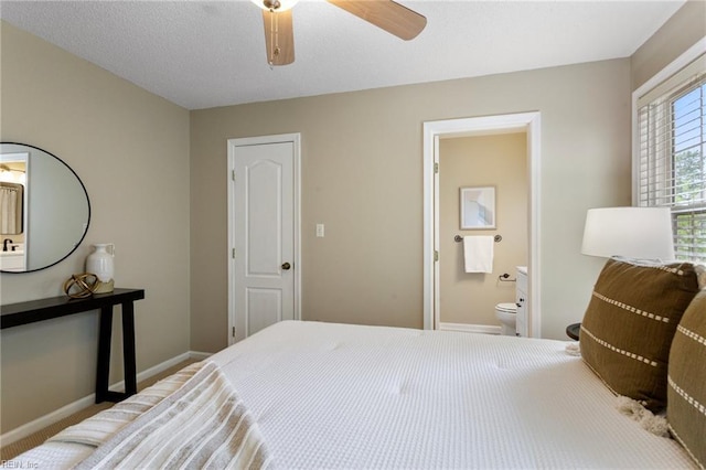 711 Windbrook Cir, Newport News, VA 23606 - bedroom with baseboards, ensuite bathroom, and a ceiling fan
