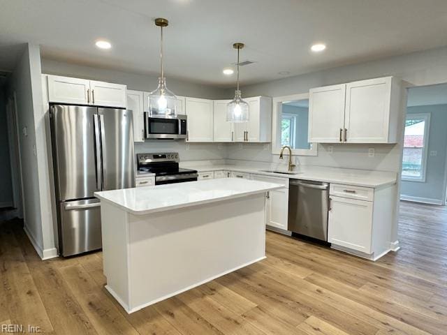 128 Ridgewood Rd, Chesapeake, VA 23325 - kitchen with stainless steel appliances, a sink, white cabinetry, a center island, and recessed lighting