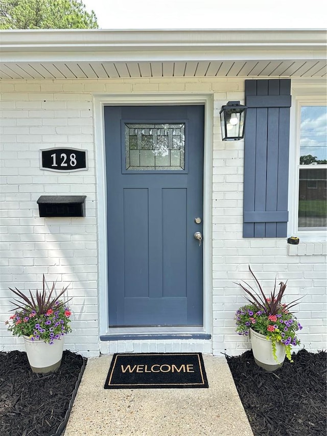 128 Ridgewood Rd, Chesapeake, VA 23325 - doorway to property with brick siding