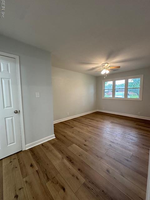 128 Ridgewood Rd, Chesapeake, VA 23325 - unfurnished room with baseboards, dark wood-type flooring, and ceiling fan