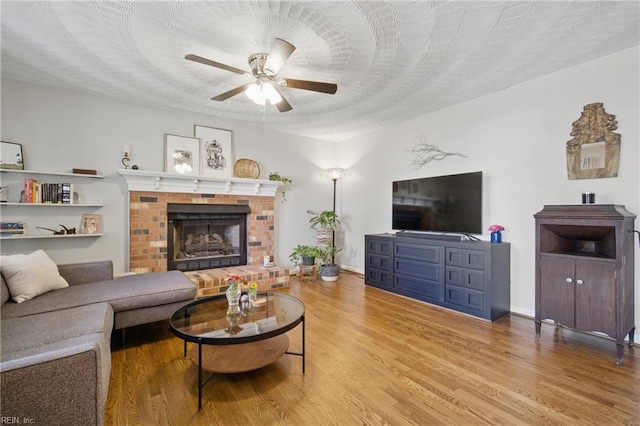 740 Hilda Pine Dr, Chesapeake, VA 23322 - living room featuring a ceiling fan, wood finished floors, and a fireplace