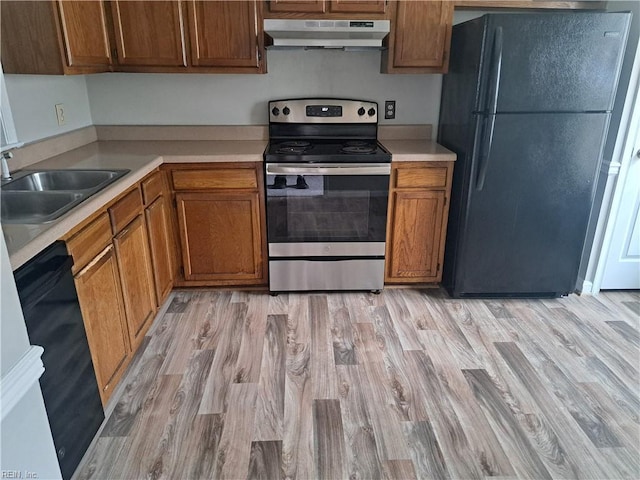 800 Pencil Box Way, Virginia Beach, VA 23462 - kitchen with black appliances, under cabinet range hood, a sink, light countertops, and light wood finished floors