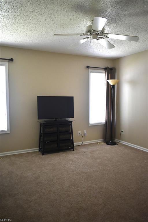 1176 Pond Cypress Dr, Virginia Beach, VA 23455 - unfurnished bedroom featuring a textured ceiling, carpet, a ceiling fan, and baseboards