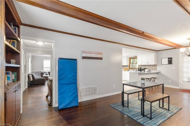 744 Village Green Pkwy, Newport News, VA 23602 - dining space with plenty of natural light, beamed ceiling, baseboards, ornamental molding, and dark wood-type flooring