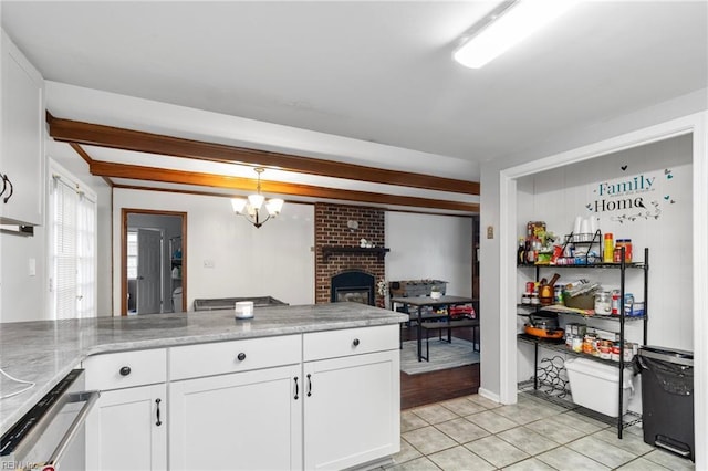 744 Village Green Pkwy, Newport News, VA 23602 - kitchen with white cabinets, a fireplace, light tile patterned floors, pendant lighting, and open floor plan