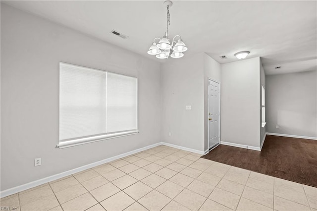 408 Coastal Walk Pl Unit 102, Virginia Beach, VA 23451 - unfurnished room featuring a chandelier and baseboards