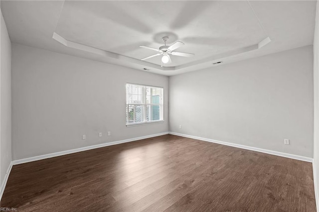408 Coastal Walk Pl Unit 102, Virginia Beach, VA 23451 - unfurnished room with a raised ceiling, a ceiling fan, baseboards, and dark wood-style flooring