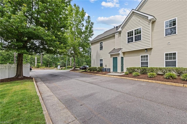 408 Coastal Walk Pl Unit 102, Virginia Beach, VA 23451 - view of asphalt road featuring curbs