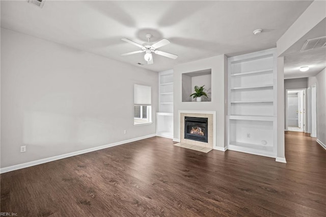 408 Coastal Walk Pl Unit 102, Virginia Beach, VA 23451 - unfurnished living room featuring built in shelves, baseboards, a tiled fireplace, wood finished floors, and a ceiling fan