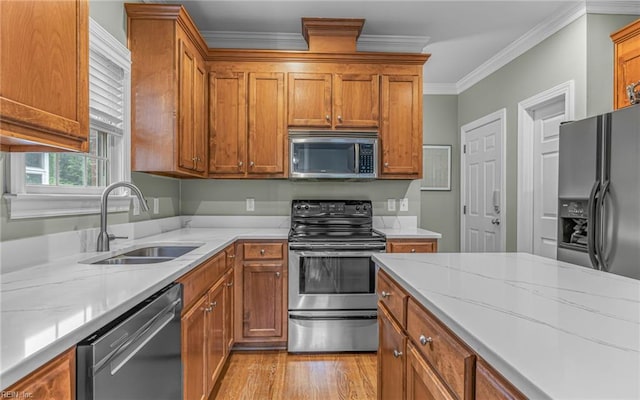 106 Edith Wharton Sq, Newport News, VA 23606 - kitchen with stainless steel appliances, a sink, ornamental molding, light stone countertops, and light wood finished floors