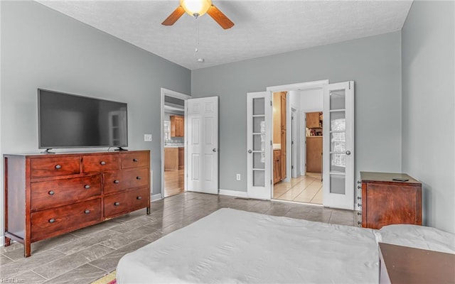 106 Edith Wharton Sq, Newport News, VA 23606 - tiled bedroom featuring a textured ceiling, ensuite bath, baseboards, ceiling fan, and french doors