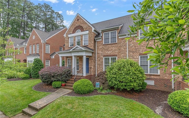 106 Edith Wharton Sq, Newport News, VA 23606 - colonial-style house featuring brick siding and a front yard